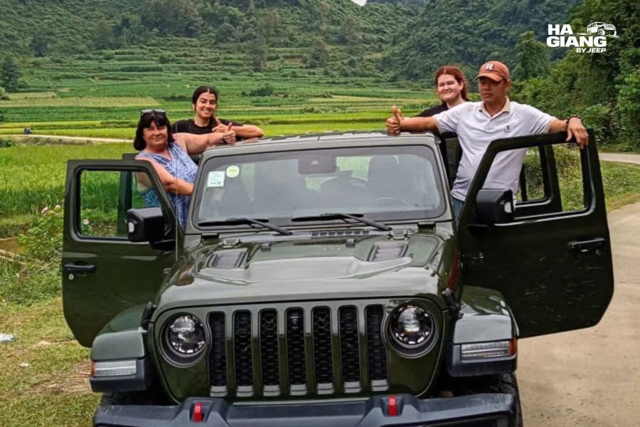 Ha Giang Loop 5 days itinerary: an open air jeep on an empty mountain road at sunrise
