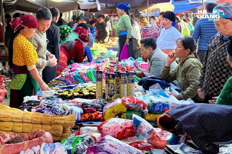 Ha Giang souvenirs including indigo hemp textiles and silver on a market stall in Dong Van