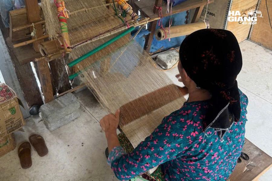 Hemp fibre being split and joined by hand as part of Hmong linen weaving in Ha Giang