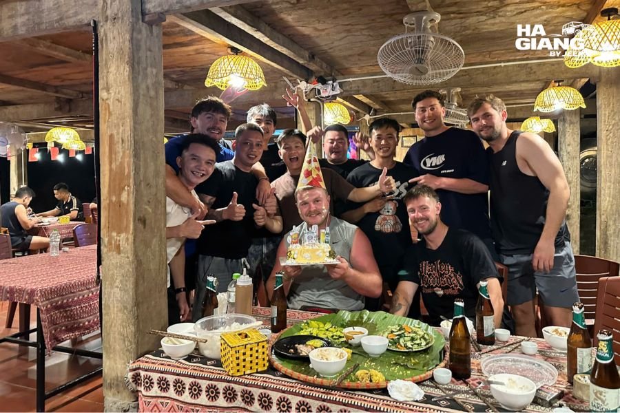 Homestay dinner in Ha Giang shared between travelers and a local host family