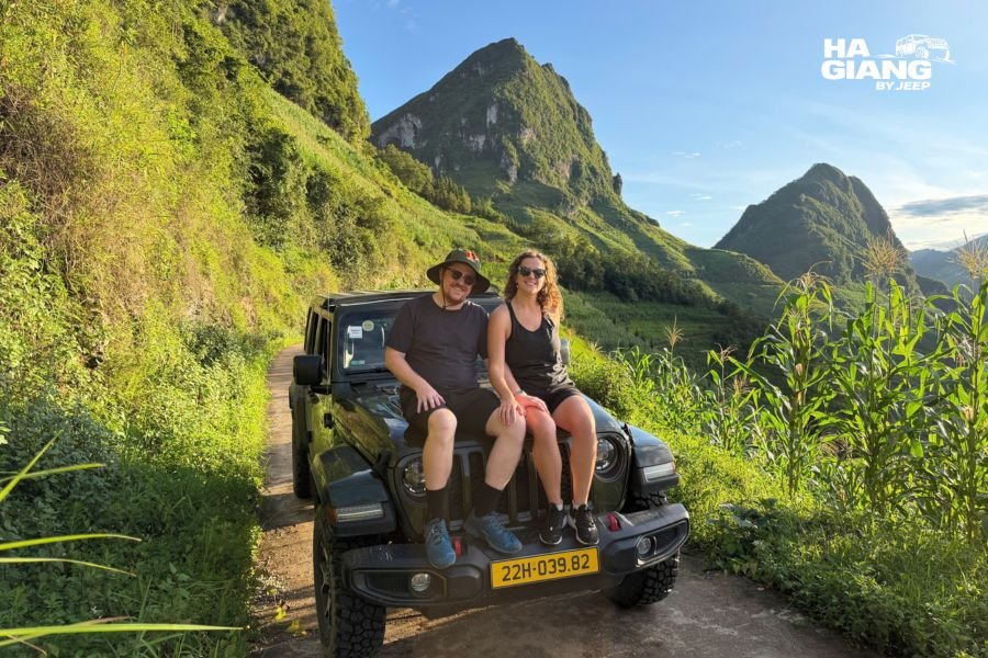 Jeep and travelers on a village road in Ha Giang during a private tour