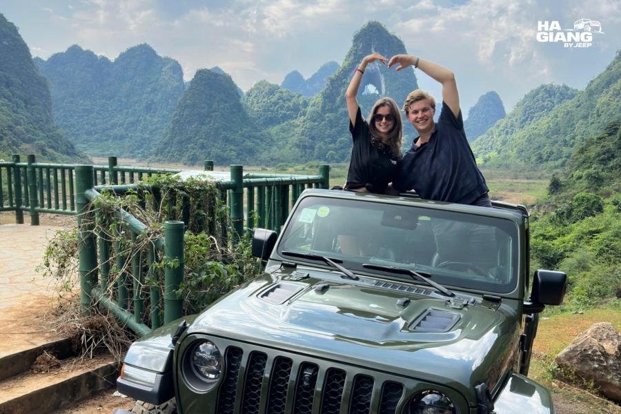 A jeep with the soft top closed on a misty day, highlands Vietnam