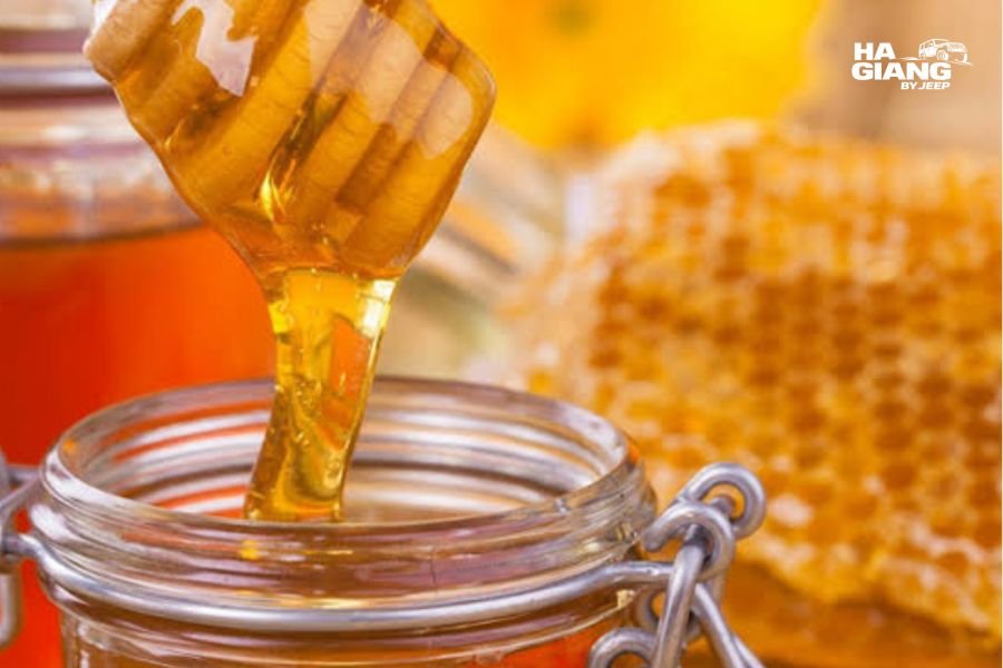 Local honey, corn wine and dried produce sold as Ha Giang souvenirs at a mountain market
