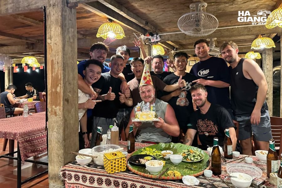 Shared dinner at a homestay on a Ha Giang jeep tour with local dishes