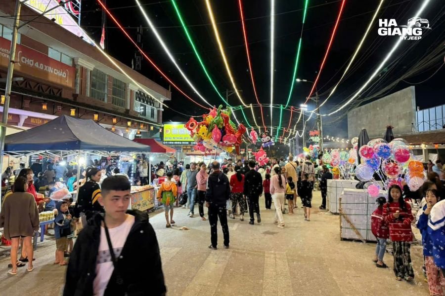 Traders and shoppers at Dong Van Sunday Market, the best place to find Ha Giang souvenirs
