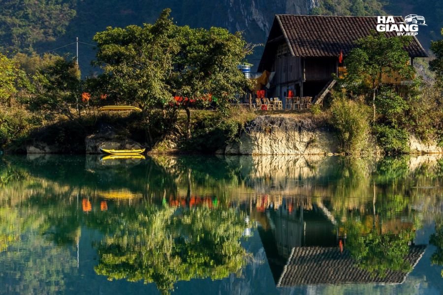 Traditional stilt houses and rice fields beside the Quay Son River in Phong Nam Valley, Cao Bang