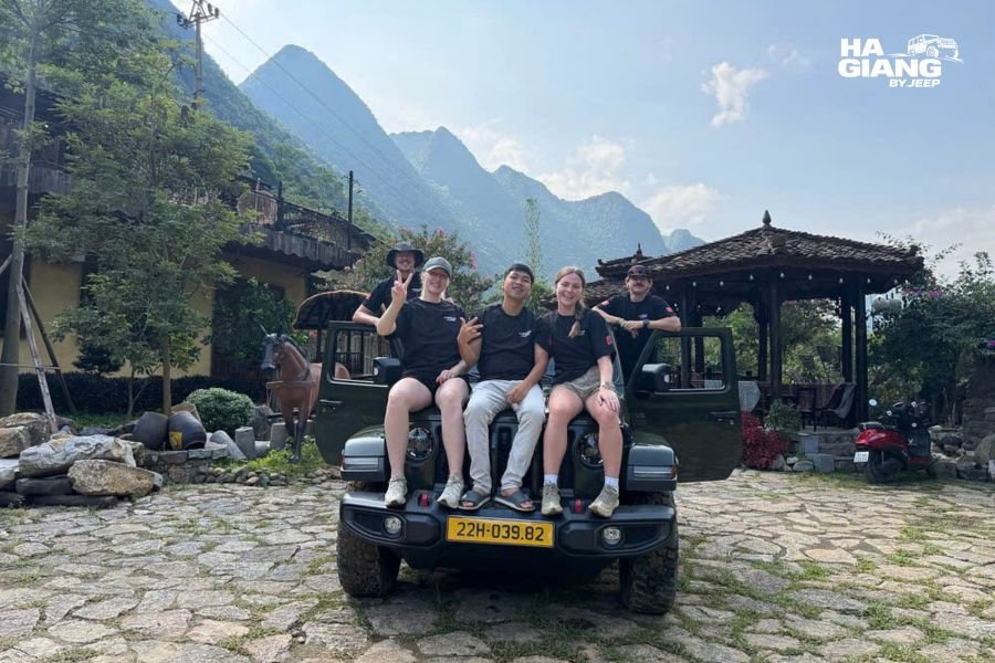 Travelers at a roadside stop on a Ha Giang jeep tour, stopping wherever they like