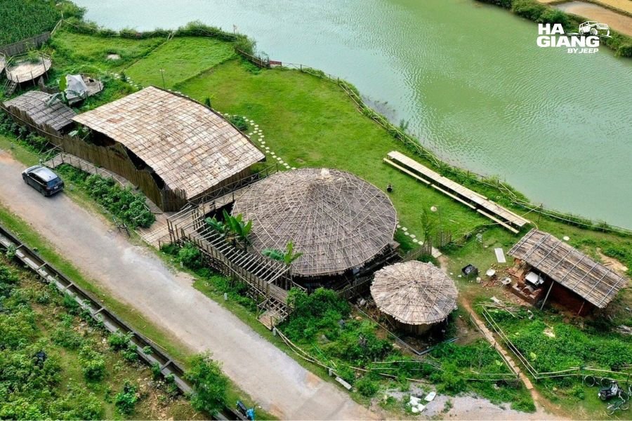 Village lane between traditional stilt houses in Phong Nam Valley, Cao Bang