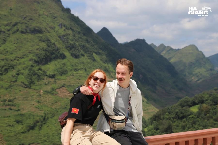 Ha Giang honeymoon: a couple at a viewpoint above the plateau