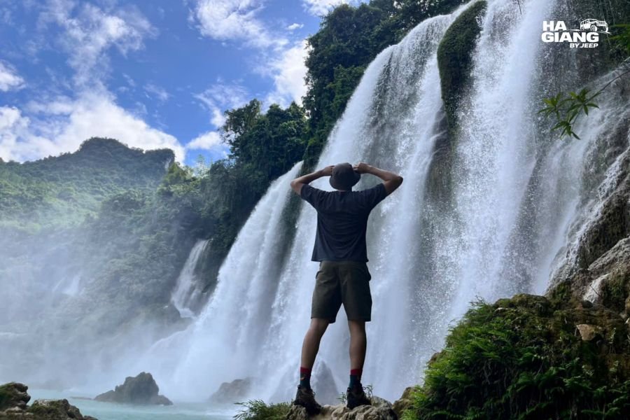 Visitors photographing Ban Gioc Waterfall from the viewing area, Cao Bang